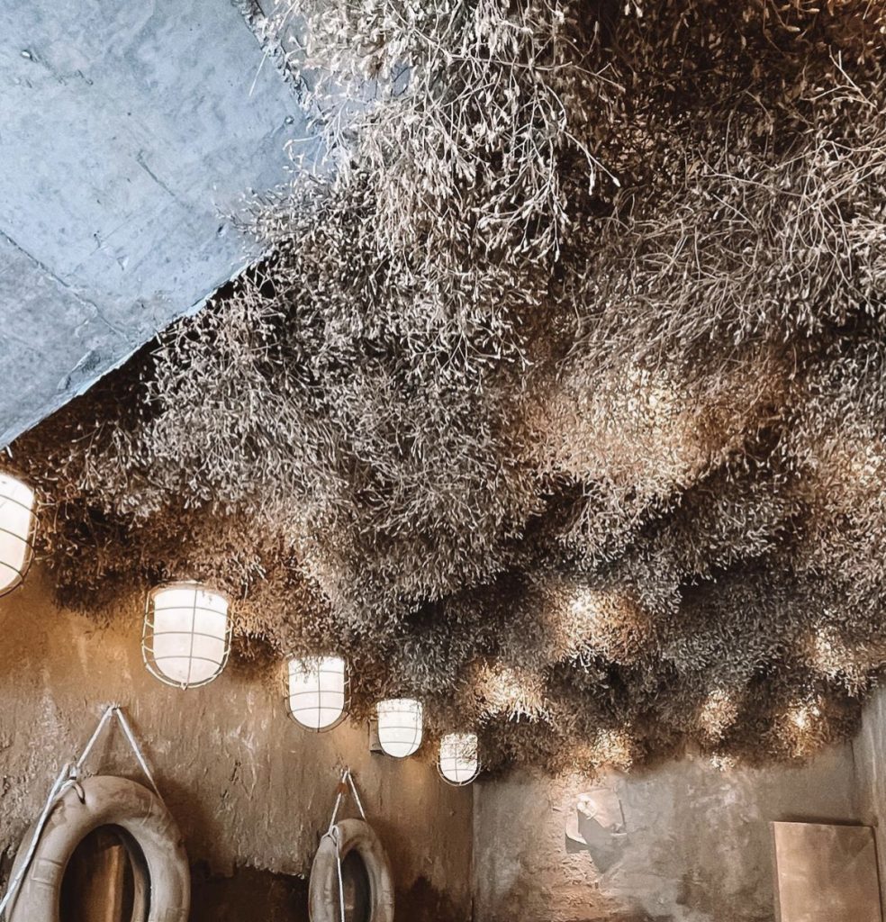Complete immersive ceiling and wall decoration with integrated lighting creating unique thematic environment in Dubai venue